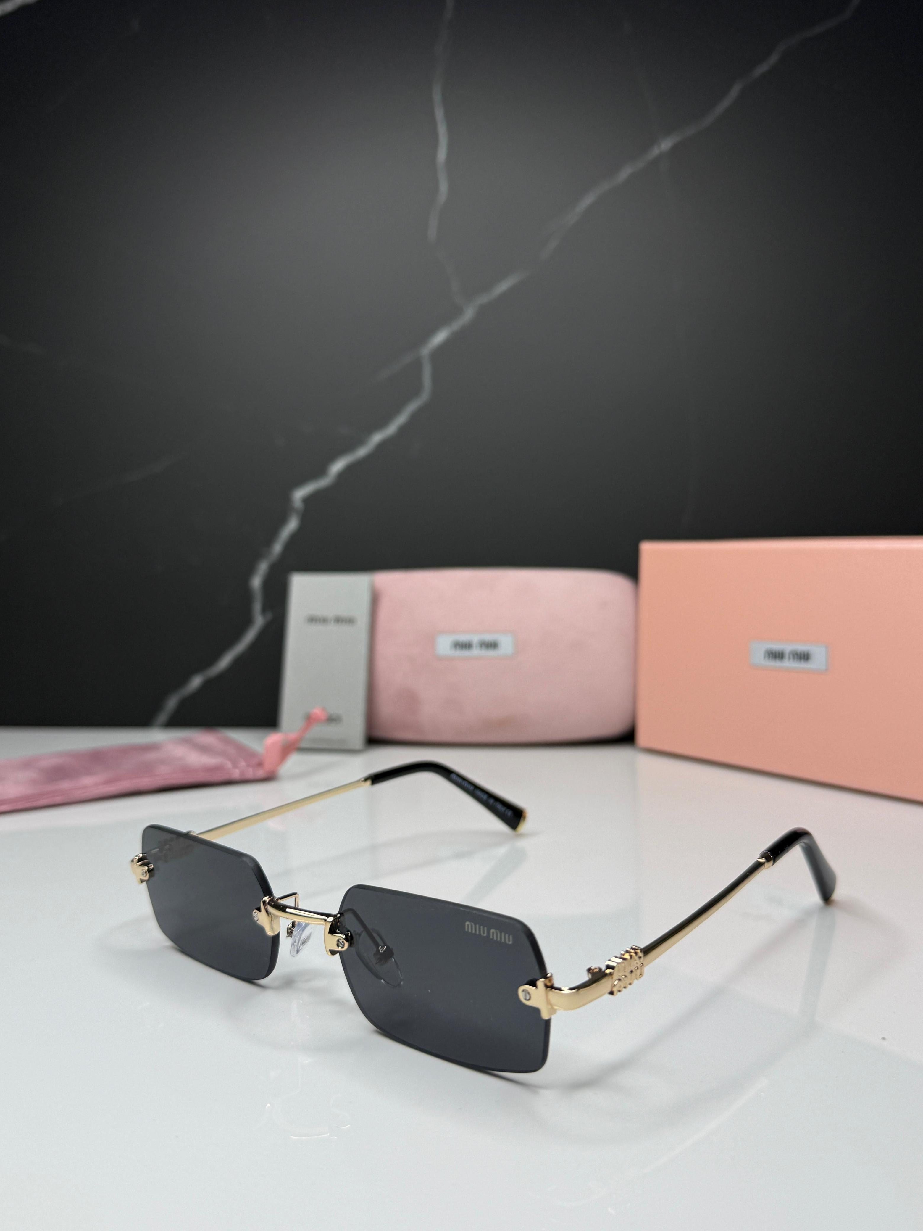 Miu Miu Rimless Sunglasses - Women